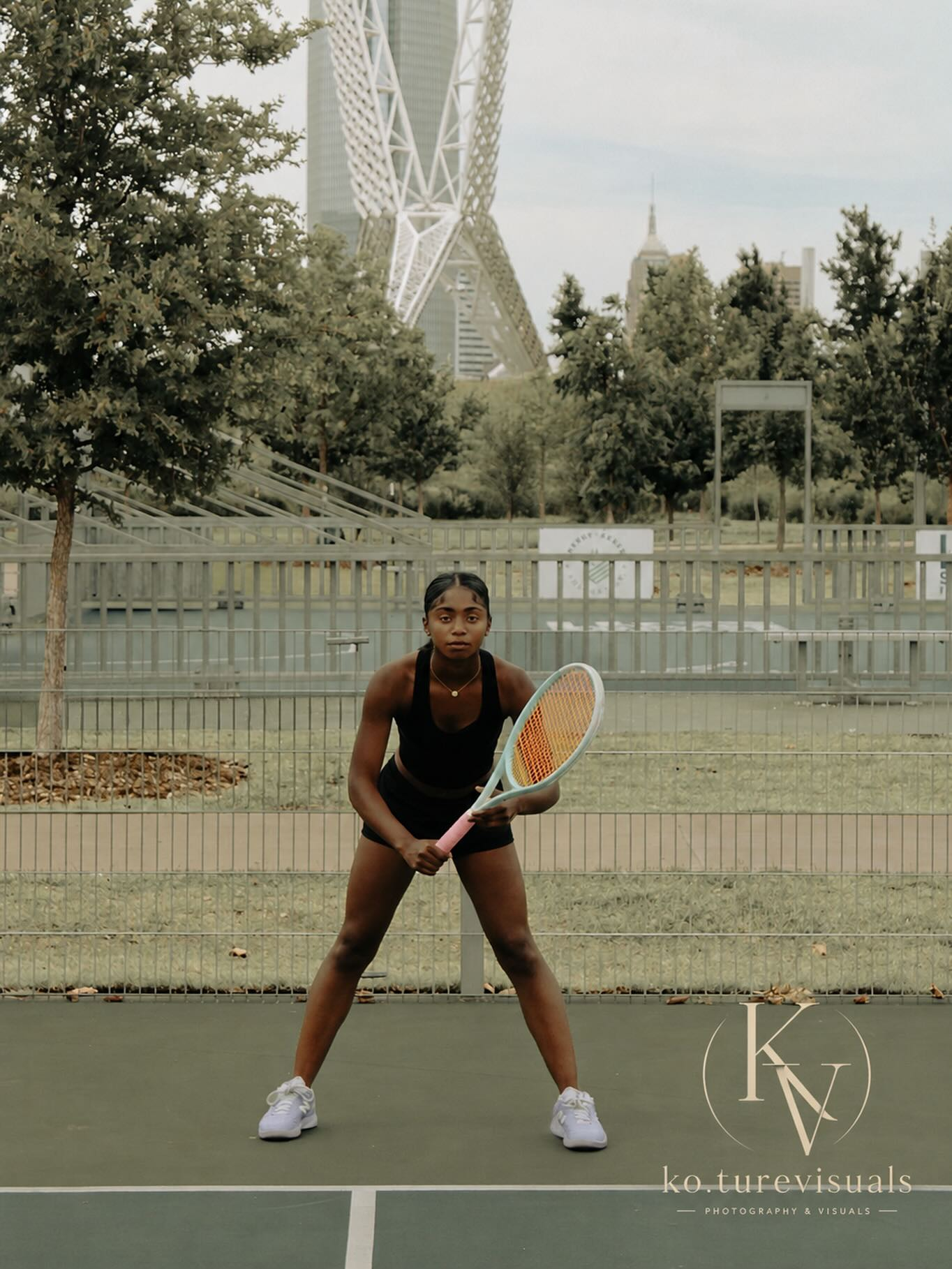 Tennis player on court with Ko.Ture Visuals watermark